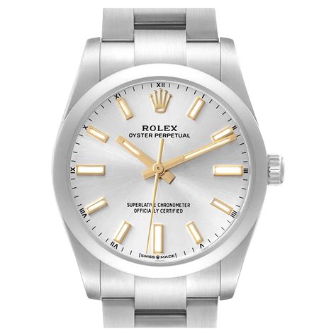 rolex oyster perpetual 124200|rolex day date 34mm.